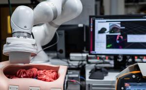 Robot navigates ultrasound pill through colon