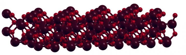 显示磁烯的晶格结构的原理图，用深红色......